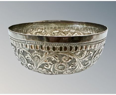 An Indian silver dish, with floral embossed detail, diameter 6.75cm.  CONDITION REPORT: 32.2g. 