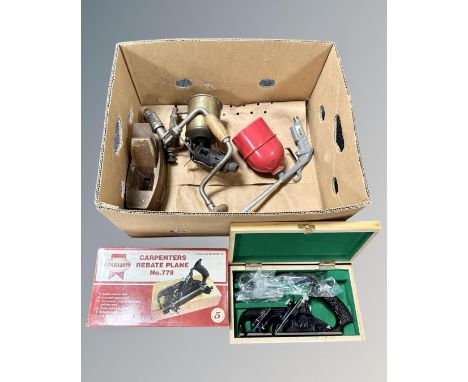 A box of tools comprising of 778 wood working plane in box, Air paraffin cleansing gun, vintage hand tools 