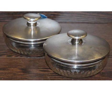 PAIR OF SILVER LIDDED TOILETTE JARS
maker F H Adams & Co., Birmingham 1920, lids with engine turned tops and mirrors set into