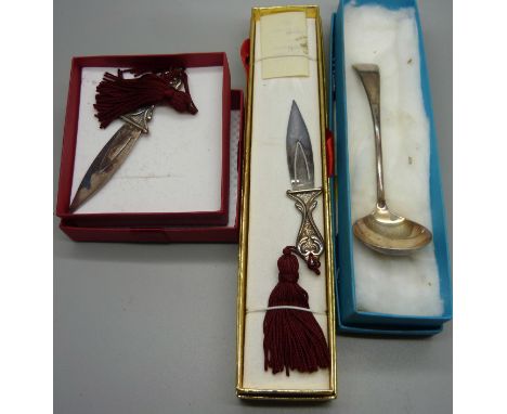 Two silver book marks and a plated ladle 