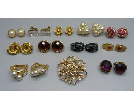 Eleven pairs of vintage earrings and a brooch 