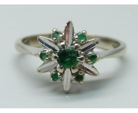 A 14k white gold and emerald cluster ring, 2.5g, L 