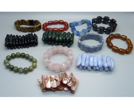 A collection of stone bracelets including agate, bloodstone, tigers eye, rose quartz, mother of pearl, etc. 