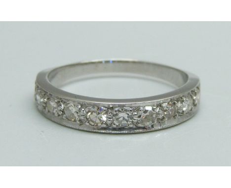 An 18ct white gold, ten stone diamond half eternity ring, 0.5ct diamond weight, 3.1g, O, (not marked, tests as 18ct gold) 