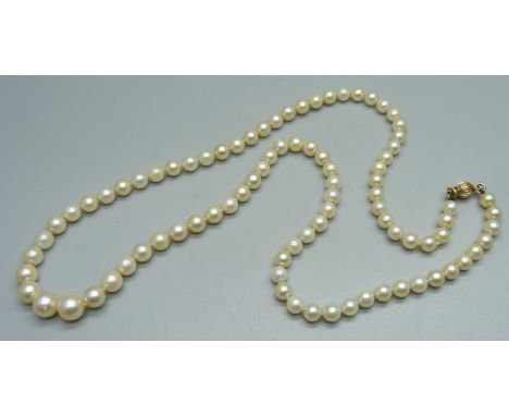 A graduated cultured pearl necklace with 9ct gold safety clasp, knotted on silk, 22" long 