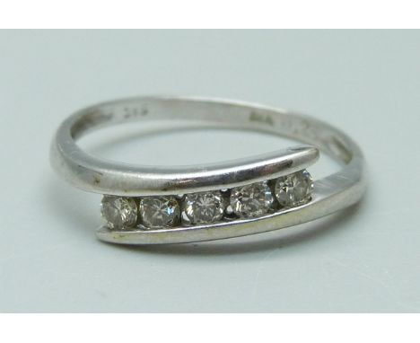 A 9ct white gold and diamond ring, 1.53g, N, 0.25ct marked on the shank 