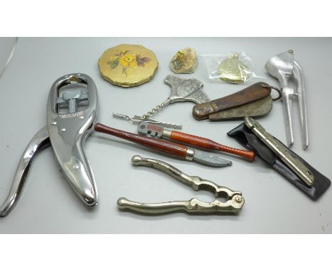 A corkscrew, a pocket watch, a pen knife and a collection of tools 