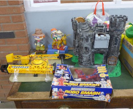 Toys; military models, Rug Rat toy, model vehicles, Robo Smash game, roller blades, a castle and Tower Crane 