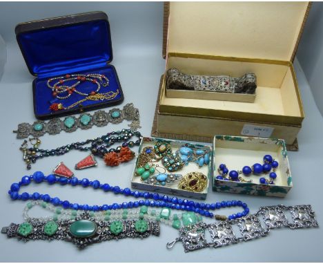 A collection of vintage costume jewellery including coral clip-on earrings, Art Deco dress clips, a pendant, vintage bracelet