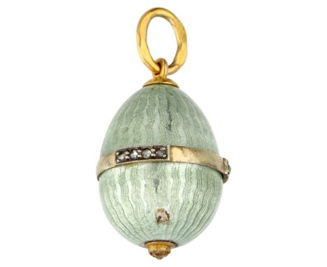 Andrei Ananov gold / silver Russian guilloche egg pendant with diamond. Light green enamel egg with a gold band all around wi