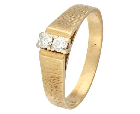 14K Yellow gold ring set with approx. 0.12 ct. diamond. Matte tapered ring set with two brilliant cut diamonds of approx. 0.1