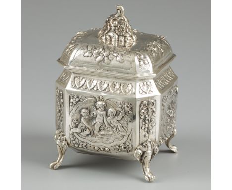 Tea caddy silver. Beautiful rectangular model with removable lid, standing on four legs. Decorated in Rococo style, gilded in