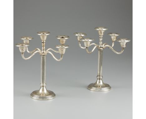 2-piece set of five-light candelabras, silver. A pair of five-light candlesticks / candelabras on a round profiled (and fille
