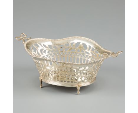 Silver sweetmeat basket. Oval model with openwork side, soldered pearl edge and bow handles. The Netherlands, Groningen, B. D