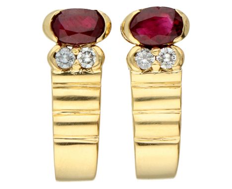 Aras Jewelers 18K yellow gold ear studs set with natural ruby and diamonds. Set with two oval faceted natural ruby of approx.