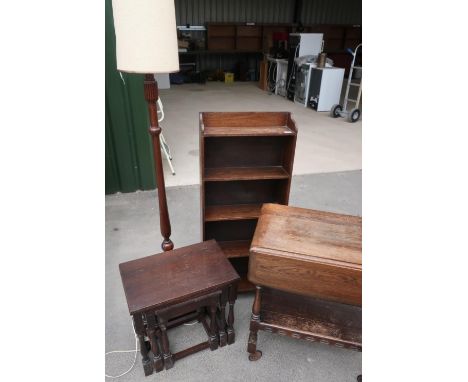 Oak five tier bookcase, an early 20th C mahogany standard lamp with turned base, an oak nest of three tables, a pair of three
