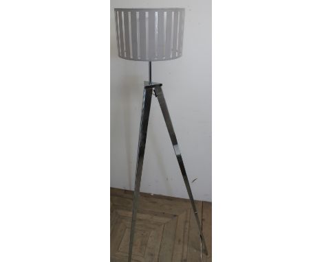 Modern design standard lamp on three chromed outsplayed supports, white pierced shade 