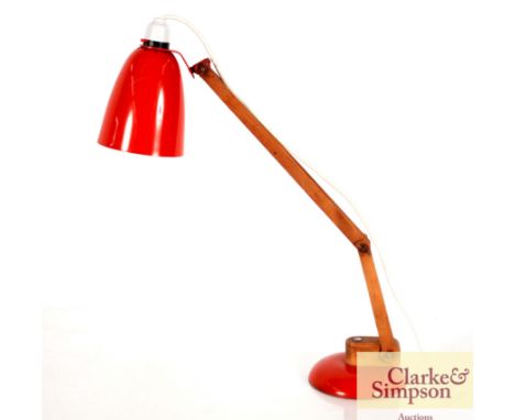 A 1950's red metal and wood angle poise lamp