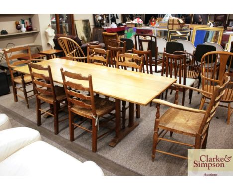 A light oak refectory type dining table raised on square section supports, 83cm x 214cm 