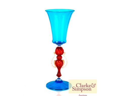 A Venetian blue glass goblet having a central ruby and gilt twist stem, 23cm high 