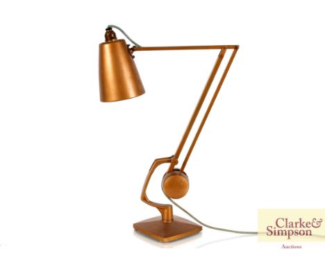 A gilt painted angle poise type table lamp