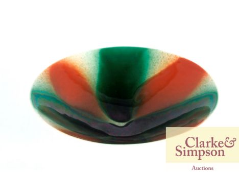 A Poole Studio pottery mid-Century dish decorated green and brown running glazes