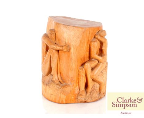 A carved wooden trunk sculpture, depicting an embracing couple and a crouching naked female figure, 32cm high