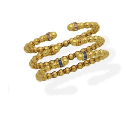 Three gem-set banglesEach designed as a series of polished beads and spacers, terminating in rows of step-cut pink, blue or y