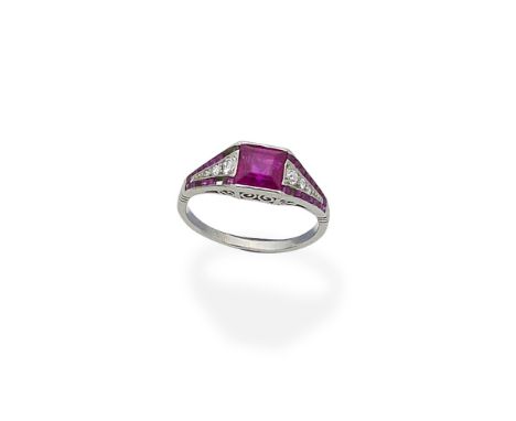 An Art Deco ruby and diamond ring, circa 1920The step-cut ruby between tapering shoulders of old brilliant-cut diamonds, with