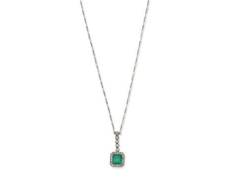 An early 20th century emerald and diamond pendant necklaceThe pendant set with an octagonal step-cut emerald within a surroun