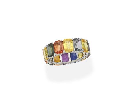 A multi gem-set eternity ringDesigned as a continuous series of step-cut vari-coloured sapphires and treated sapphires and a 
