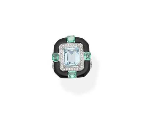 An aquamarine, emerald, onyx and diamond ringThe step-cut aquamarine and brilliant-cut diamond cluster within an onyx surroun