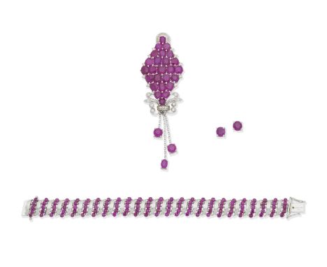 A ruby and diamond pendant, a ruby bracelet and a pair of ruby earstuds1st: The navette-shaped panel set throughout with circ