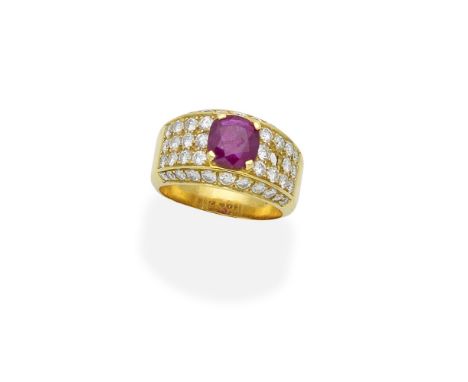 A ruby and diamond ringThe oval-cut ruby to a band pavé-set with brilliant-cut diamonds, diamonds approx. 1.30cts total, one 