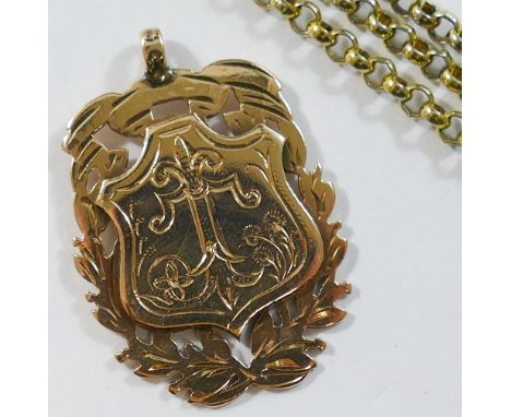 A 9 carat gold medal, Birmingham 1900, 11.5g, and a gold plated chain CONDITION REPORT: Please note - Descriptions do not inc