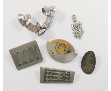 A Swedish panel brooch by Rune Tennesmed, signed, 5cm long, a Norwegian pewter panel brooch by Bodren Mylius, 4.2cm wide, a s