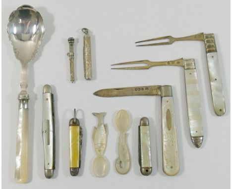 Two Georgian silver and mother of pearl folding fruit forks, a silver and mother of pearl folding fruit knife, a mother of pe