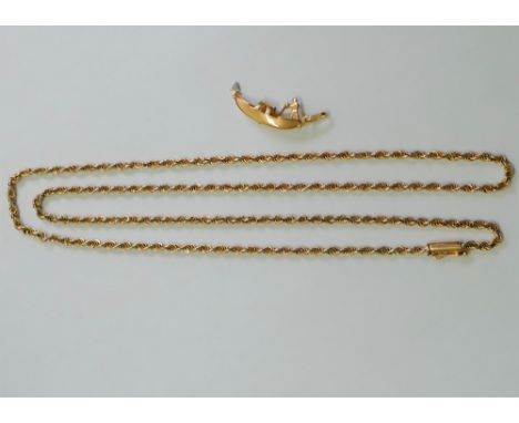 A yellow metal rope twist chain, with barrel clasp, stamped '18K', 64.5cm long, 16.7g and a yellow metal charm of a gondola, 