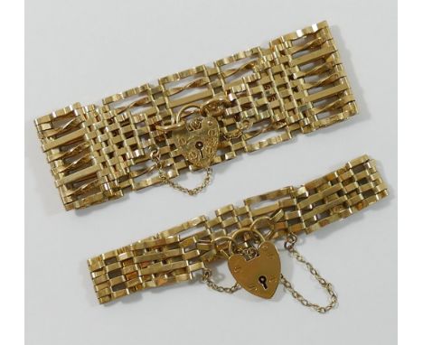 A 9 carat gold gate link bracelet, 2.6cm wide, and another 1.2cm wide, both secured with heart-shaped padlock clasps, combine