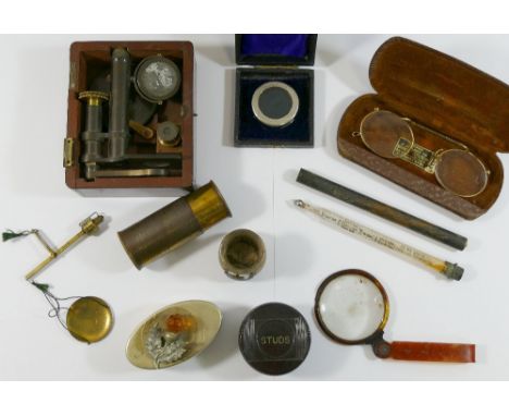 A 19th century brass miniature microscope, housed in fitted mahogany case (lid lacking), other optical items, a set of pocket