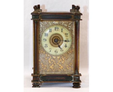 An early 20th century French brass cased five glass carriage clock, the front with gilt brass fretwork panel decorated with g