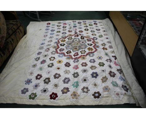 Patch work quilt, the quilt with rows of patches leading to the central rosette patch section, 250cm x 210cm
