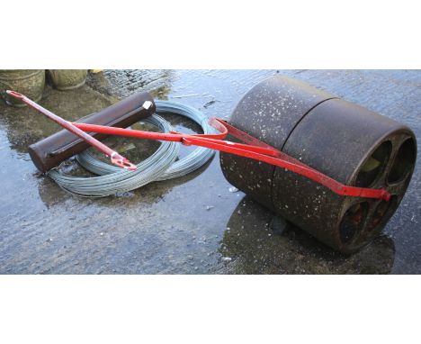A vintage cast metal lawn roller. L135cm