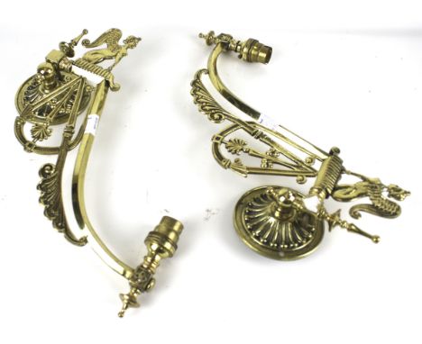 A pair of brass swivel wall light brackets. With sphinx decoration, H30cm Condition Report: Believed to be late 20th century 