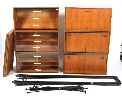 A mid-century Ladderax freestanding shelf display unit. Including four black painted side uprights and six various cupboard u