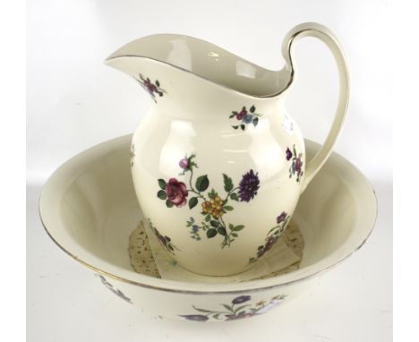 A 20th century wash basin and pitcher. With transfer printed floral decoration on a cream ground, H31cm