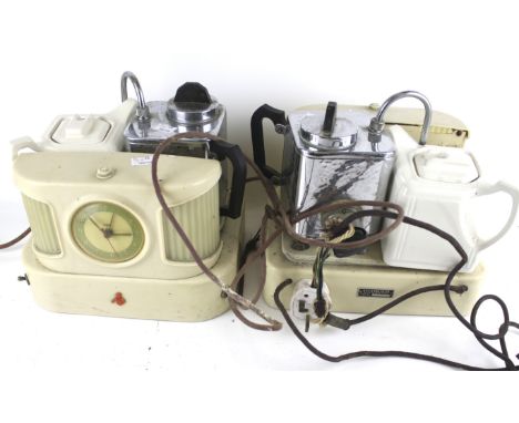 Two vintage 1970's Goblin 'teasmade'. Each featuring an alarm clock, a kettle, and a ceramic teapot, H26.5cm