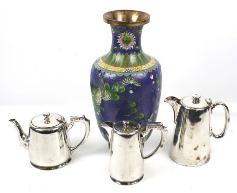 A hotel plate three piece tea service and an oriental enamel vase. The vase decorated with flowers and foliage on a blue grou