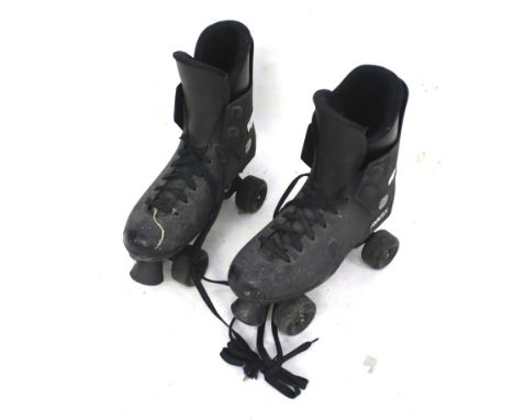 A pair of vintage Roces roller skates. With black exterior and laces, size unknown