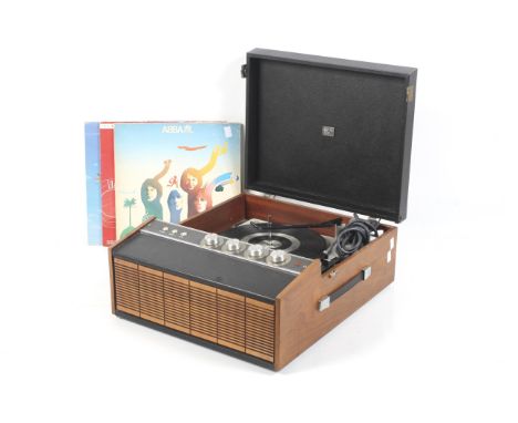 A vintage portable HMV four speed vinyl record player. Model 2042 s/n. 007913 in a teak case, plastic handle on one side and 